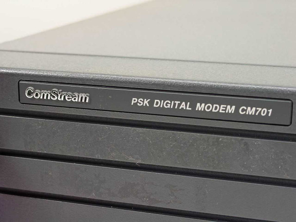 ComStream PSK Digital Modem CM701 nameplate label close-up on front panel bezel