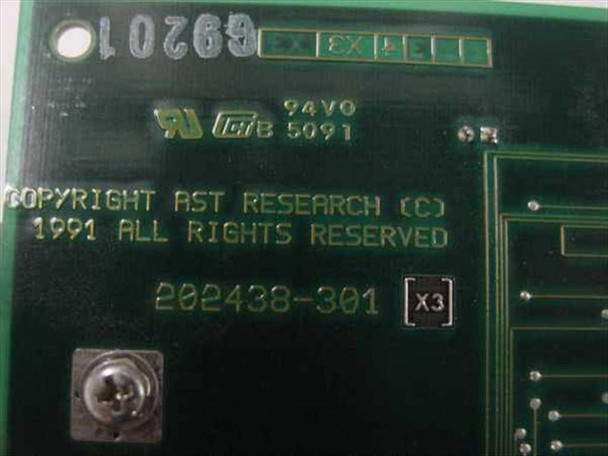 AST Research PCB silkscreen closeup — copyright AST Research 1991, board revision marking 202438-301 X3, UL 94V0 flammability rating visible