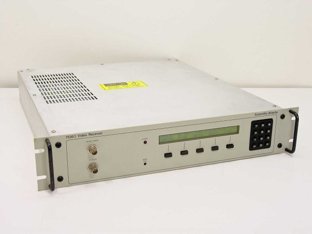 Scientific Atlanta 7530I L-Band Video Receiver — front panel three-quarter view showing LCD display, keypad, and BNC connectors with rack ears installed