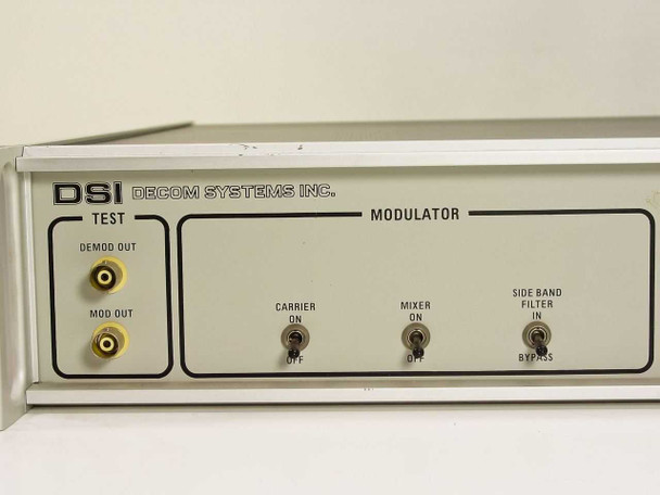 Decom Systems DSI 7132 PSK Modem – close-up of left front panel showing DSI logo, TEST BNC outputs (DEMOD OUT, MOD OUT), and Modulator toggle switches