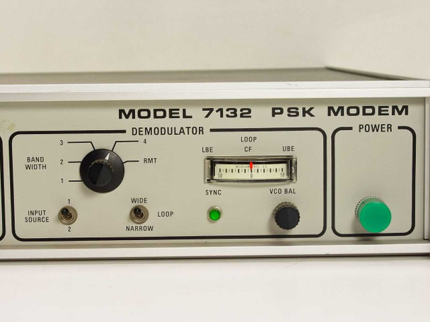 Decom Systems DSI 7132 PSK Modem – close-up of right front panel showing Demodulator bandwidth knob, input source switch, VCO BAL meter, and green power button
