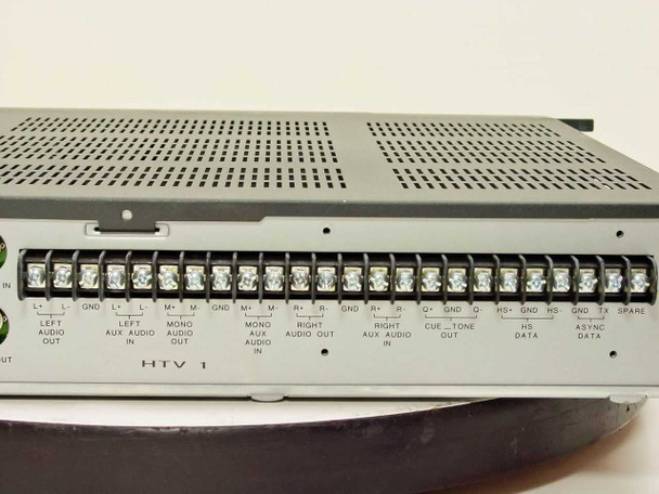 General Instrument DSR4400 rear panel close-up showing HTV 1 terminal block strip with labeled connections: Left Audio Out, Aux Audio In/Out, Mono Audio, Right Audio In/Out, Cue Tone, HS Data, Async Data, TX Spare