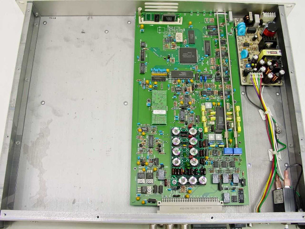 Leitch VGD-3200E interior view showing main PCB with multiple ICs, analog and digital circuitry, and internal power supply board