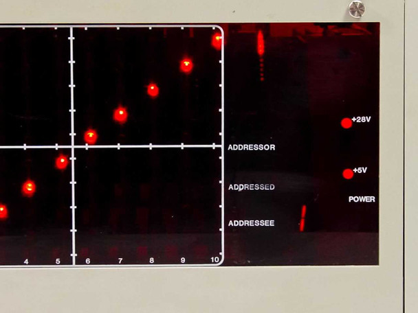 Close-up of Matrix Systems 10360 right-side front panel showing ADDRESSOR, ADDRESSED, ADDRESSEE labels and +28V, +5V, POWER LED status indicators