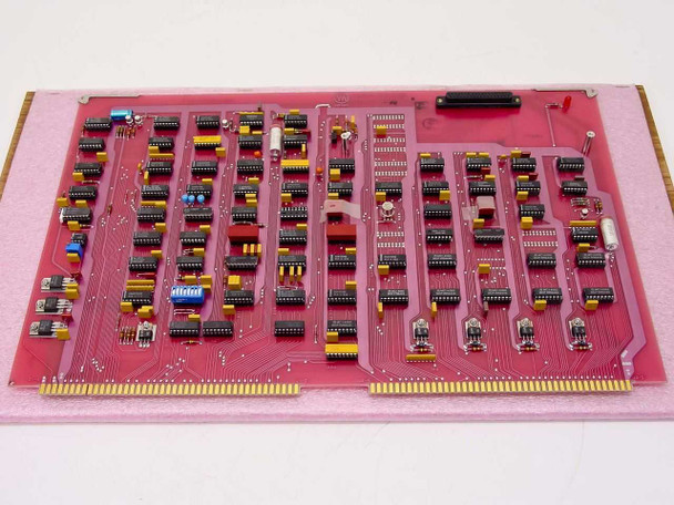 Varian 01002543-00 Control Logic Board Rev M — rear side showing solder side of pink PCB with gold edge connector