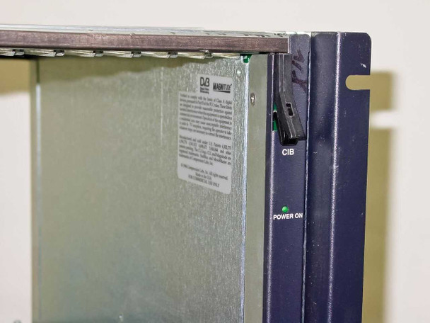 General Instrument CLI Magnitude MPEG Encoder — left side panel detail showing CIB toggle switch and green Power On LED indicator, DVB compliance label partially visible