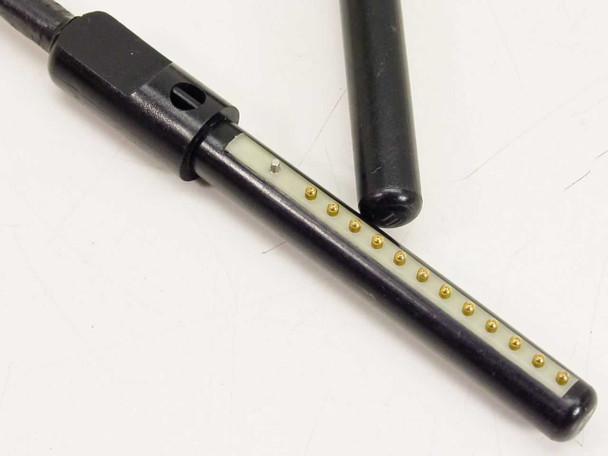Close-up of Dynatech 12-pin pogo pin connector showing gold-plated spring contact pins arranged in a single row on the black connector body