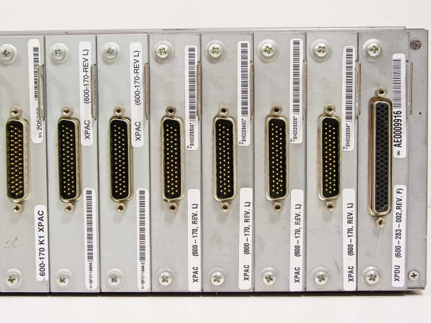 Cybex Commander 4XP module close-up showing individual XPAC 600-170 REV L modules and one XPDU 600-233-002 REV F module with high-density connectors