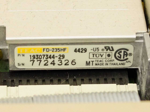 TEAC FD-235HF floppy drive label showing model FD-235HF, part number 19307344-29, serial number 7724326, TUV and UL certifications, Made in Thailand
