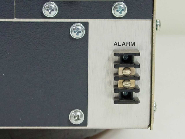 Rear panel detail showing screw-terminal ALARM output connector block