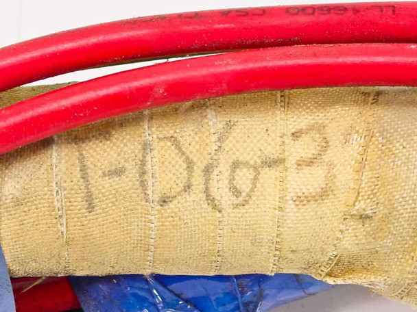 Titan Industrial heating element end showing hand-written part number T-06-37 on refractory wrapping with red supply lead visible