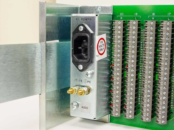 BTS RF-3000A rear panel closeup showing IEC C14 AC POWER inlet with 115 VOLTS ONLY sticker, ground binding post, AUDIO label, and BAA-3000 card terminal strips numbered by channel