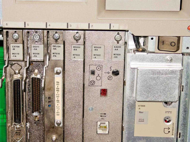 Close-up of DEC cards: CXY08-M M3119-YA, DSV11-SA M3108-PA, OELQA-SA M7516-PA, MS650-BA M7622-A (x2), KA650-AA M7620-AA CPU, and H7868-A Rev P04 power supply