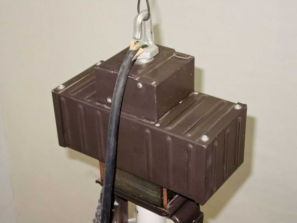 Lumark HID fixture ballast housing top view — dual ballast cans with pendant mount hook and supply wiring