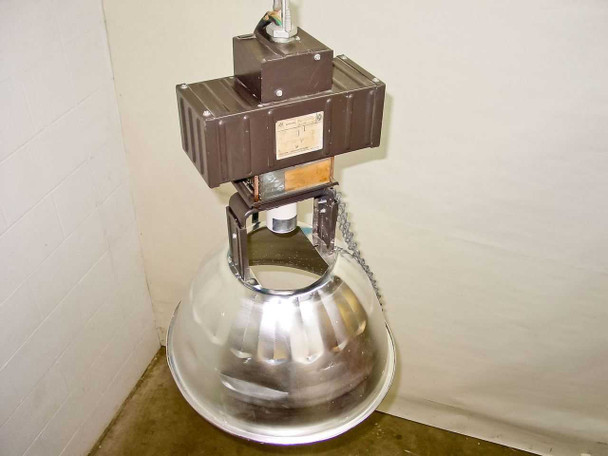 Lumark MHSS-M-400-MT-U HID warehouse fixture — three-quarter view showing full assembly with reflector and safety chain