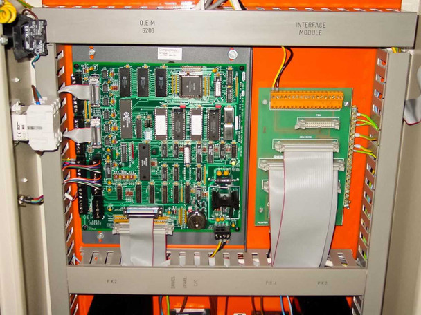 HyBond 616-12 power panel interior showing OEM 8200 interface module PCB with ribbon cable connections on orange-painted chassis