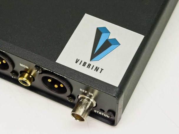 Vibrint Technologies logo close-up on audio console corner with REF IN BNC and STATUS LED visible