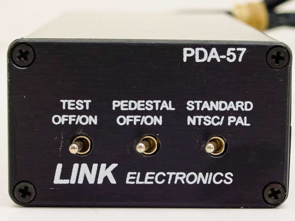 Link Electronics PDA-57 front panel close-up showing Test Off/On, Pedestal Off/On, and Standard NTSC/PAL toggle switches