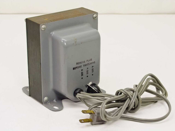 Switchable AC transformer rear view — voltage selector switch and 'Remove Plug Before Switching' label with 105V 115V 125V positions visible