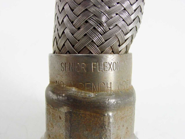 Senior Flexonics brand stamp on hose fitting collar reading SENIOR FLEXONICS NO WRENCH AREA