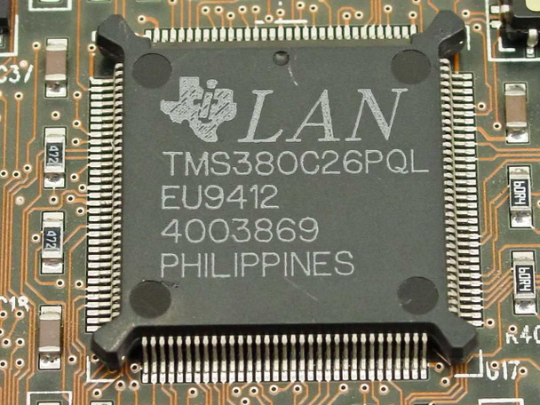Close-up of Texas Instruments TMS380C26PQL LAN controller chip on Cabletron T2015 card
