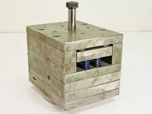 Spring Loaded CD Disk Inner Torsion Unit 20725 – front-right three-quarter view showing stainless steel laminated body and two blue torsion springs in open slot