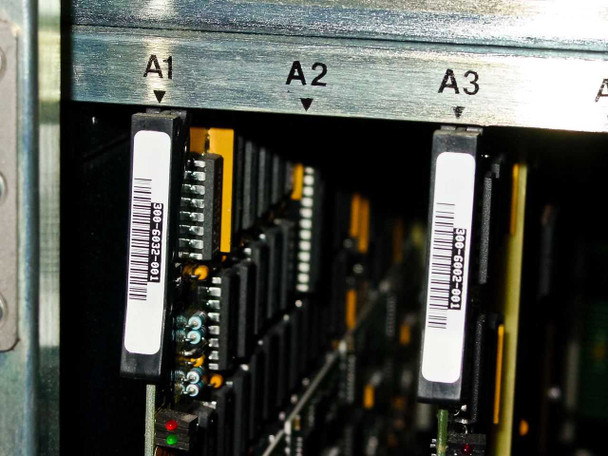 Octel VMX200 close-up of card slots A1, A2, and A3 showing installed cards with barcode labels including part number 300-6032-001
