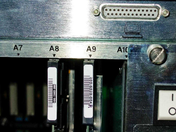Octel VMX200 card slots A7 through A10 close-up showing cards with barcode labels including part number 300-6039-004R and DB25 connector above