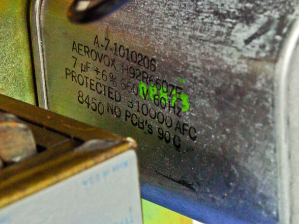 Internal Aerovox H92R6607F filter capacitor label showing 7uF 660V 60Hz, protected, 8450 no PCBs