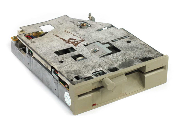 Mitsumi D503V 5.25-inch half-height floppy drive – top and front view showing grey bezel and dusty metal chassis