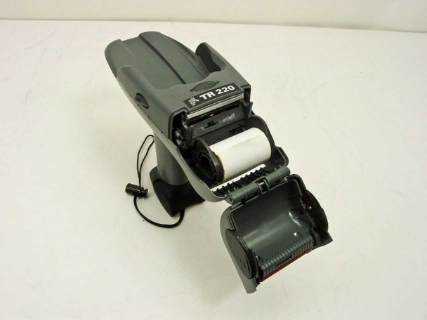 Zebra TR220 portable label printer with paper door fully open showing thermal print mechanism and platen roller