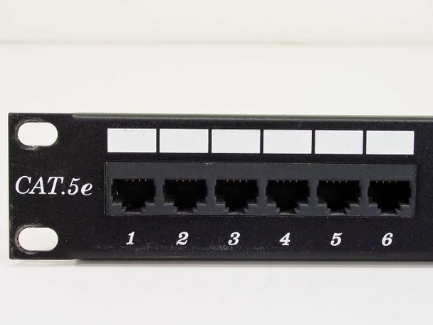 Close-up of Dynacom CAT 5e patch panel left section showing ports 1-6 and CAT.5e label on front face