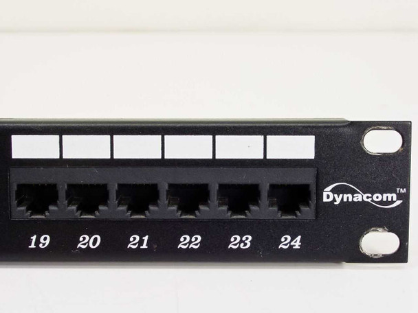 Close-up of Dynacom CAT 5e patch panel right section showing ports 19-24 and Dynacom logo