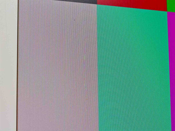 Close-up of ADI MicroScan A508 screen surface showing color bars and a visible vertical scratch near the left side of the display