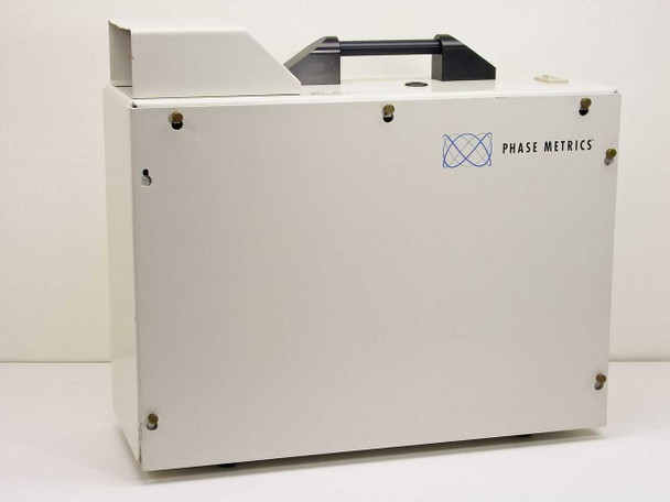 Phase Metrics Lamphouse 038050101 arc lamp source — right-side exterior view showing Phase Metrics logo on white enclosure with carry handle