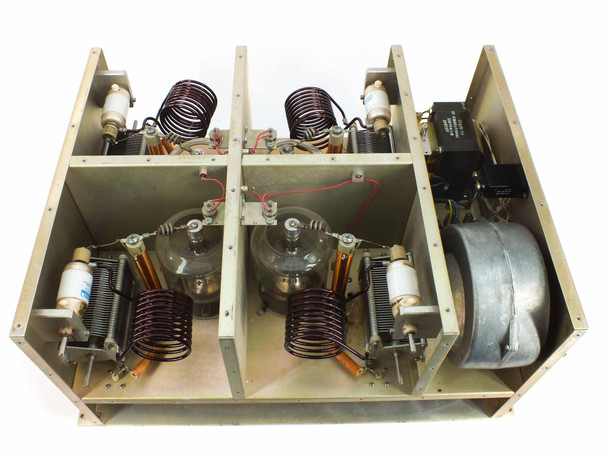 MRC A114265 Quad 1000 RF Deck – interior top-down view showing four Eimac 3-500Z triode tubes, large inductor coils, Jennings vacuum variable capacitors, and EBM blower on right side
