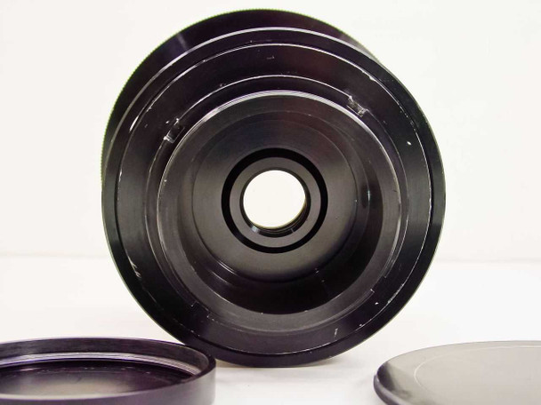 GE GL-132 projector lens front optical element view showing lens housing with both protective caps removed and placed below