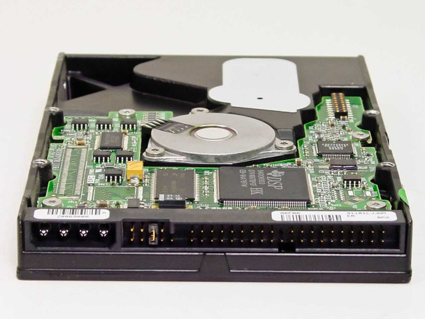 Compaq 218318-001 20GB hard drive — PCB bottom view showing IDE connector, jumper pins, and controller board detail
