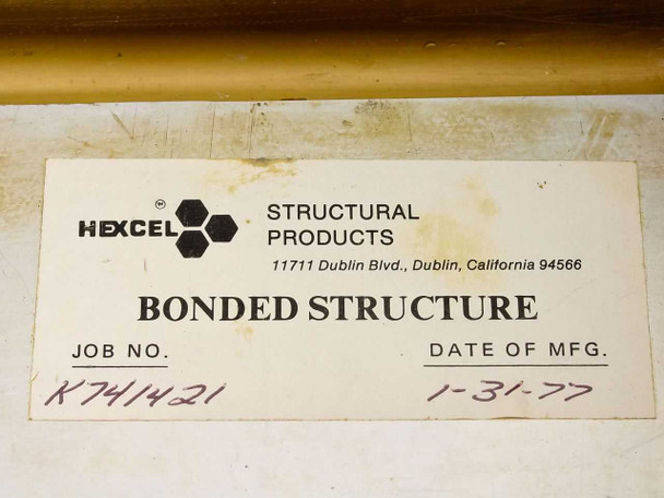 Hexcel Structural Products bonded structure label showing Job No. K741421 and Date of Manufacture 1-31-77, affixed to gold-anodized enclosure lid