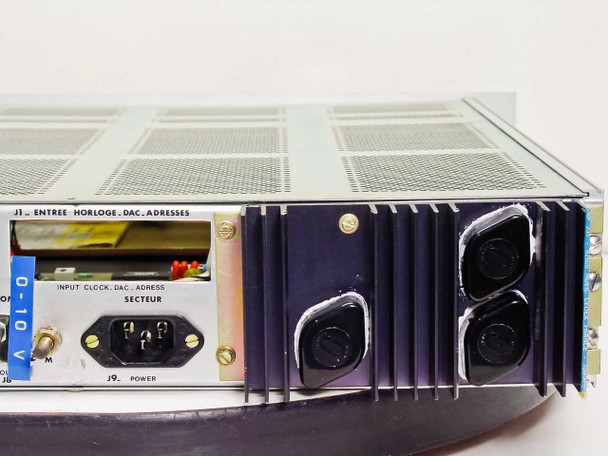 Riber CD 116 rear panel left side showing IEC power inlet (J9 Secteur), input clock/DAC/address connector J1, and large external heatsink