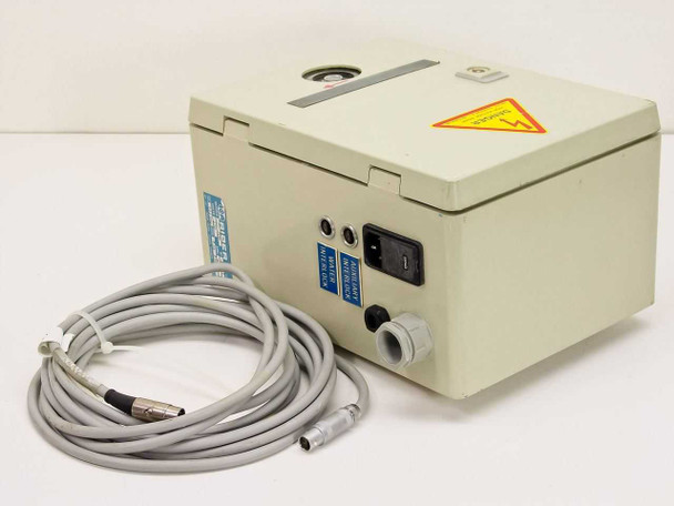 ISA Riber CX 700 flow meter enclosure rear-left view showing IEC 220VAC power inlet, auxiliary interlock and water interlock circular connectors, and attached multi-pin cable