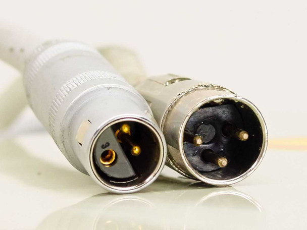 Multi-pin circular connector cable ends — two male connectors with gold pins, used for auxiliary or water interlock connections on ISA Riber CX 700