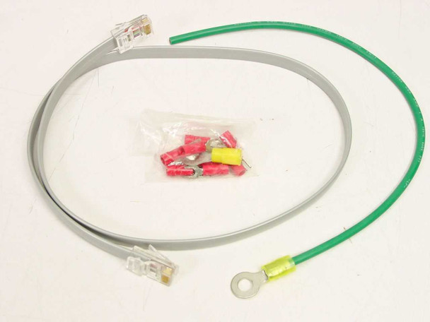 Included accessories for AC Data Systems TJ1010B: RJ-48C patch cable, green grounding cable with ring terminal, and bag of red and yellow wire terminals