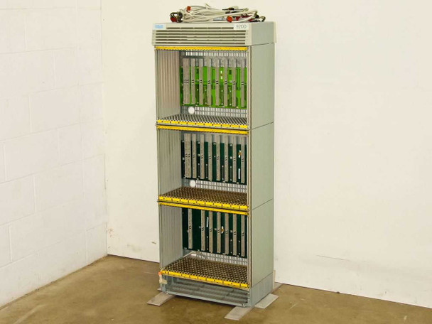Rolm 9200 PBX 3-stack chassis – full front view showing three shelf bays with partial green boards and yellow backplane connectors