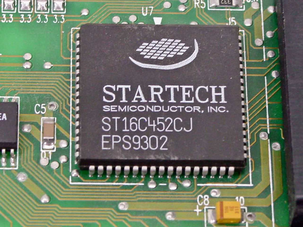 Close-up of Startech Semiconductor ST16C452CJ EPS9302 dual UART chip on Boca Research BRI4340 ISA I/O card