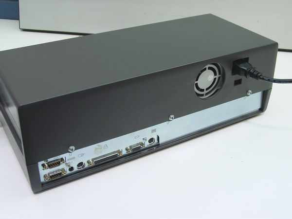 AST PowerStation III Docking Station 501681-001 — rear panel showing serial, parallel, monitor, audio ports, rear exhaust fan, and power cable