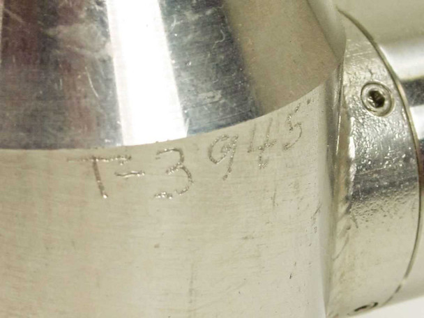 Close-up of stamped identifier T-3945 engraved on the stainless steel sensor body