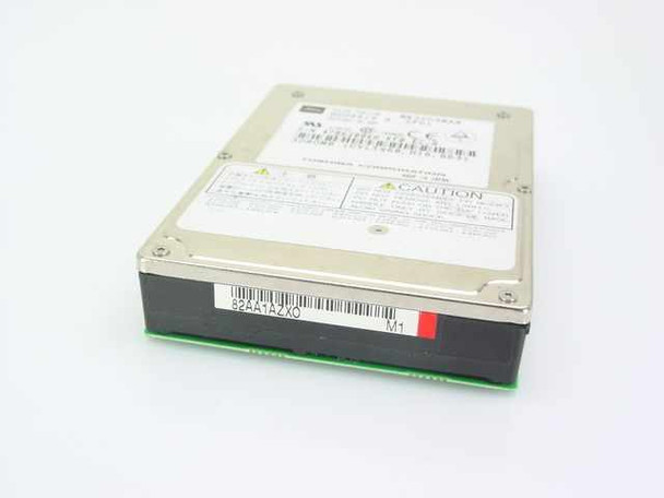 Toshiba MK3003MAN 2.5-inch laptop hard drive – angled top view showing label and caution sticker