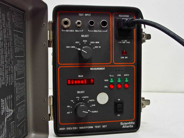 Scientific Atlanta A931 powered on showing red LED display reading Signal with case open and AC recharge cord connected