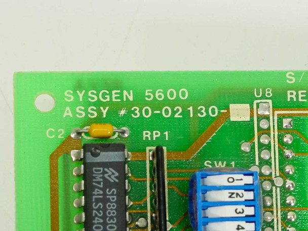 Close-up of Sysgen 5600 PCB silkscreen showing ASSY 30-02130 label, DM74LS240 IC, and DIP switch SW1
